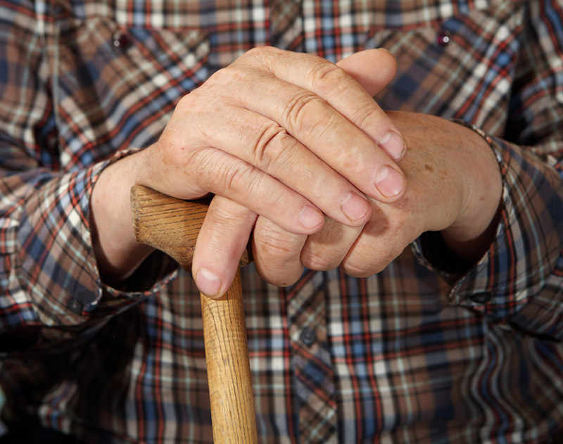 man holding his cane